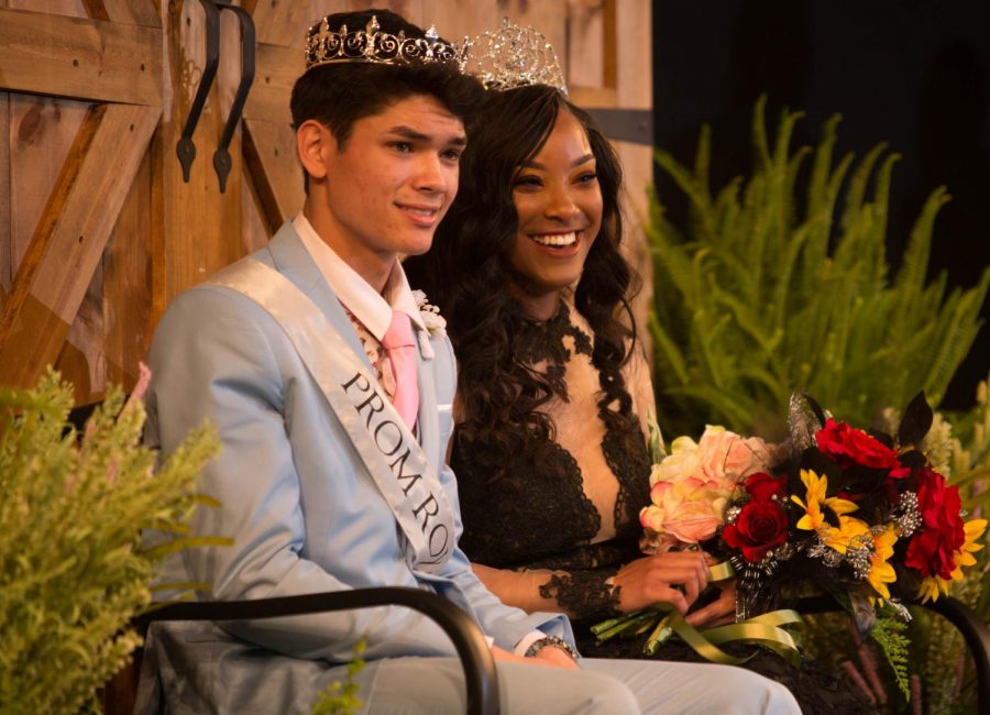 Nick Sursa, 19 and JaMeziah Lesure, 19 bask in royalty on the Schweinfurth stage as they are awarded Prom King and Queen of last years prom. Sursa and Lesure won the award on Saturday April 14, 2018. 
