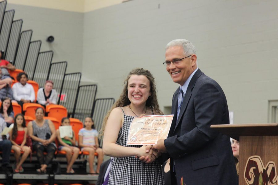 Maria Byers, ‘19 accepts the FFA Alumni Scholarship from Mr. John Kabat. This will be John Kabat’s last official year as a teacher at MV. 
