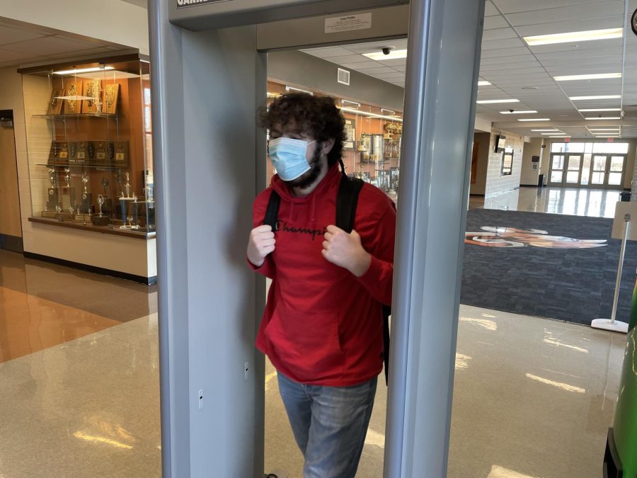 Senior Sam Visser walks through the metal detector